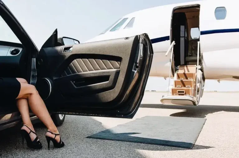 “Luxury aircraft upholstery client beside private jet—First Class MasterCraft aviation interiors”