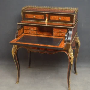 “Ornate writing desk with curved legs and two-tiered structure—expertly restored”