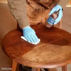 “Close-up of antique furniture restoration—intricate detailing and careful craftsmanship”