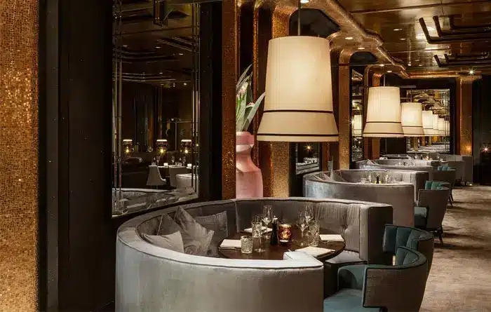 Custom-built commercial banquette with tailored upholstery and curved seating – installed in NYC hospitality space