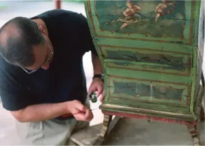 Leather panel and wood panels touch-up for faded spot – restored by First Class MasterCraft mobile team
