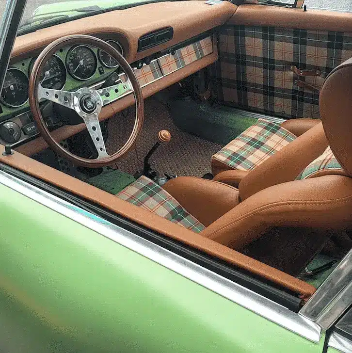 “1960s coupe interior with stitched vinyl and restored trim—First Class craftsmanship”