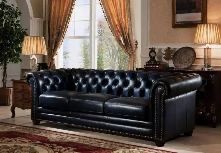 Sun-faded sofa with custom dye and conditioning treatment – leather repair by First Class MasterCraft