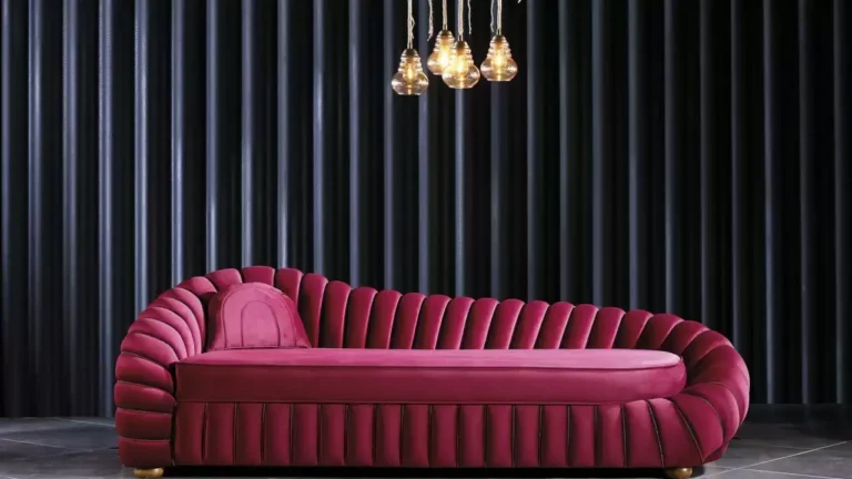 “Upholstered sofa with hand-stitched detailing”