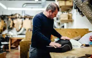 upholsterer replacing the car seat