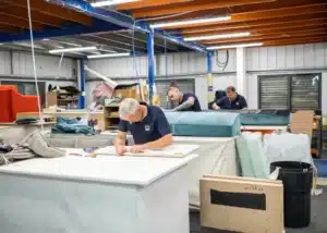 Upholstery specialist preparing materials for custom restoration – First Class MasterCraft Fort Lee