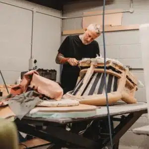 upholstery team repairing a chair in fort lee shop