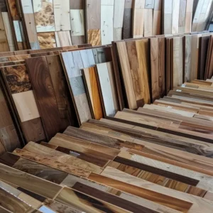 “Assorted wood planks in workshop—premium materials for custom cabinetry and architectural millwork”